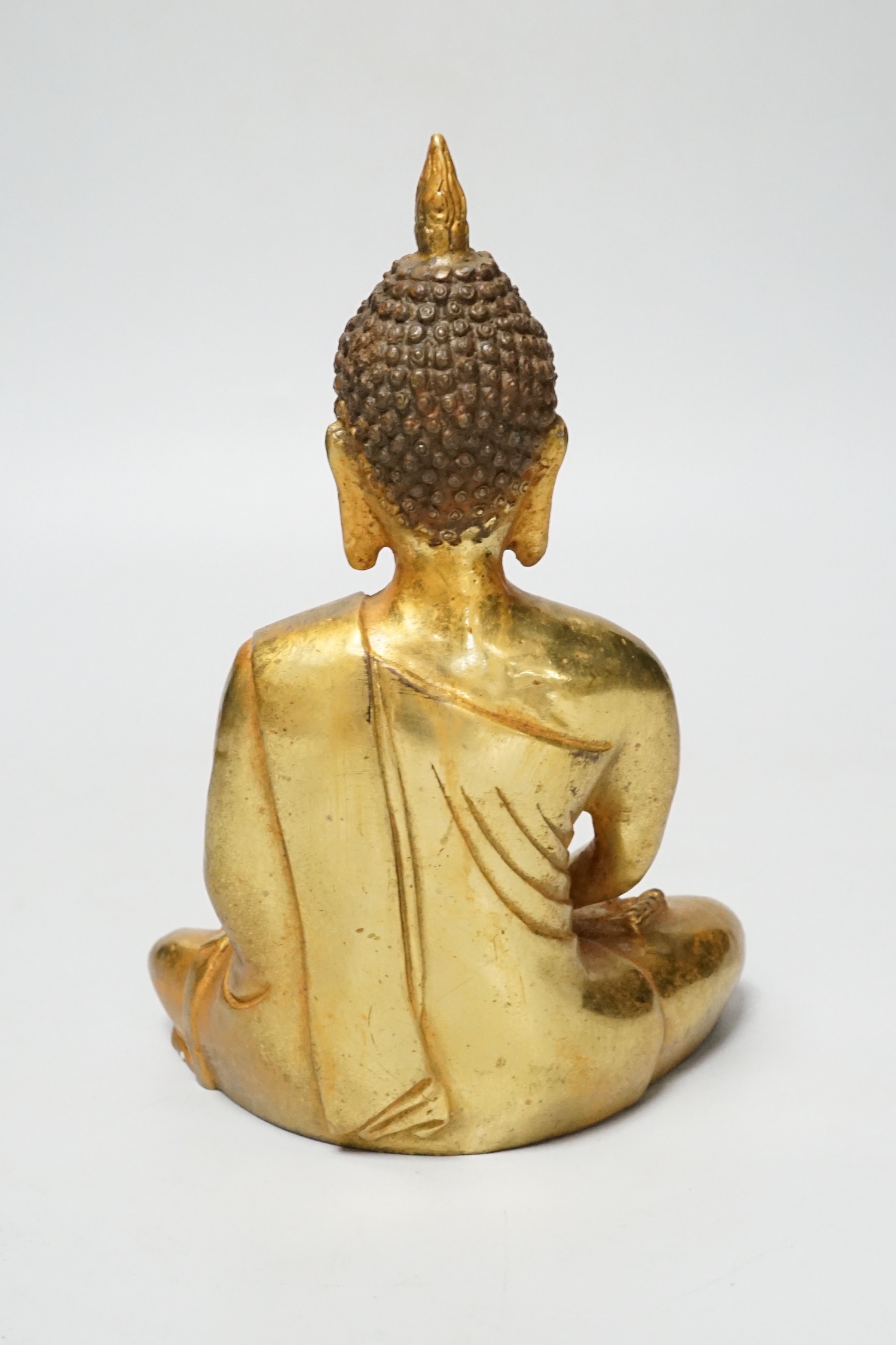 A South East Asian gilt bronze figure of Buddha, 16cm high